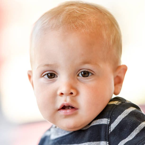 istock Baby boy looking at the camera 613668794