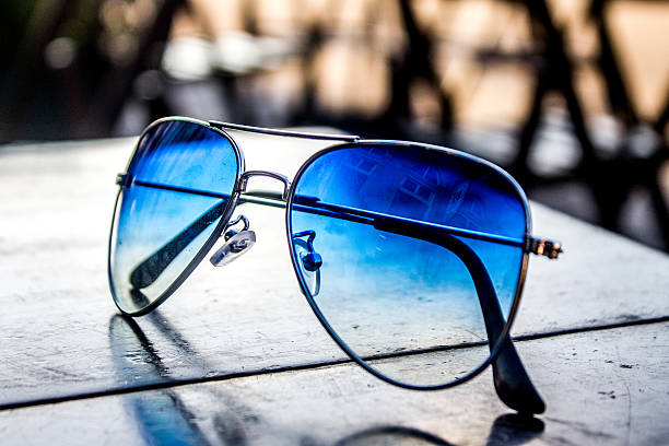 istock Glasses on a table of a park 613668832