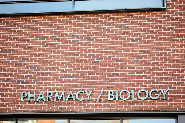 istock Pharmacy and biology sign on building 613669514