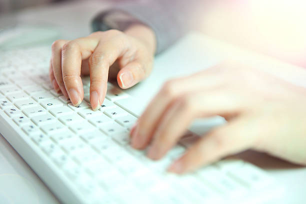 istock woman Hands is  typing 613670074