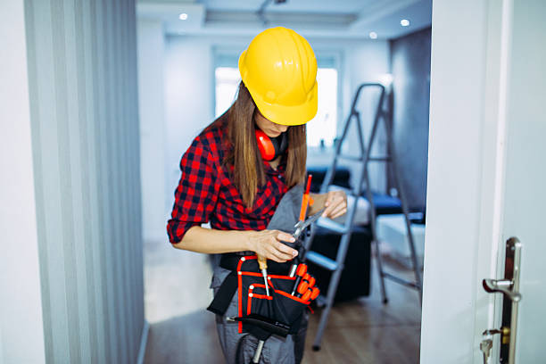 istock Female handy woman working indoors 613670264