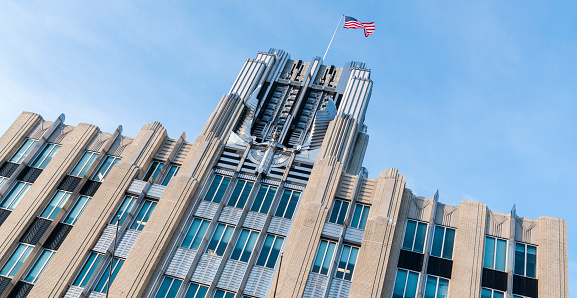 The iconic Niagara Mohawk Building with an American flag in Syracuse, New York, USA