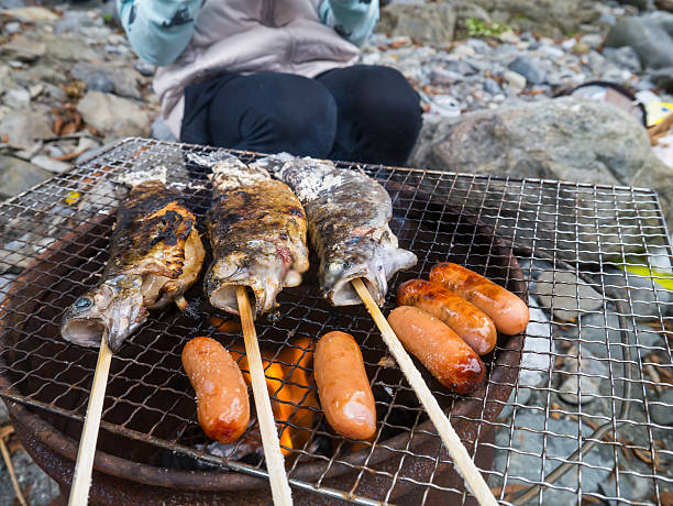 istock Enjoy fish and meat at BBQ 613673212