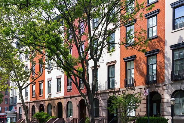 istock Tree Lined Stree in Manhattan New York City 613673602