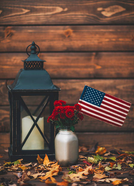 istock Luxe still life arrangement with flowers and flag. Fall holidays 613674626
