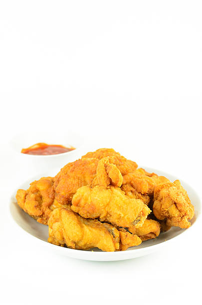 istock Crispy fried Chicken and tomato sauce isolated on white background 613675802