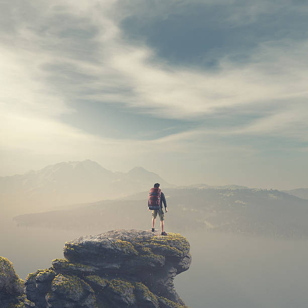 istock Hiker with backpack standing on top of a mountain 613676062