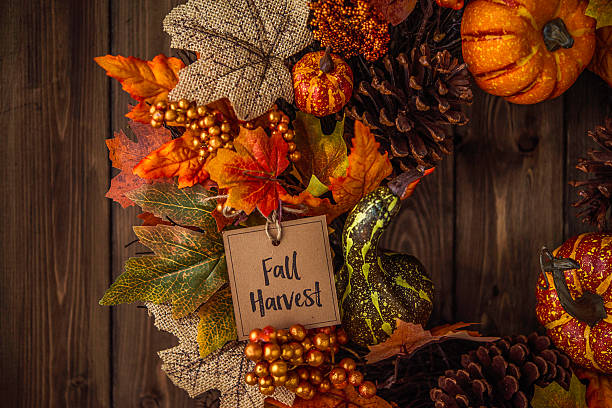 istock Ornate fall wreath with pumpkins, pinecones, message and leaves 613677922
