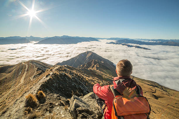 istock Mountaineer on the top of mountain 613680678