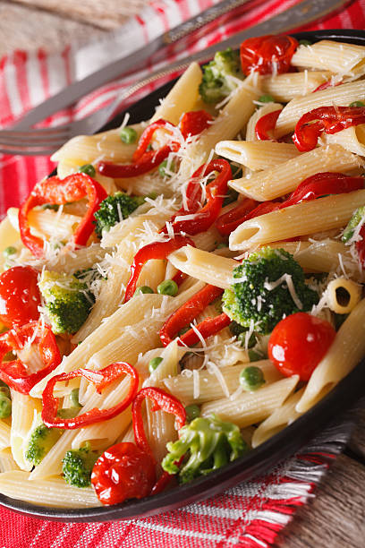 istock Italian Pasta Primavera with Parmesan close-up. vertical 613680980