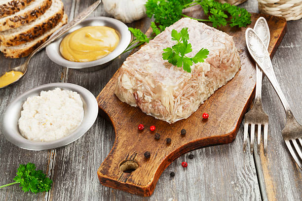 Homemade jelly meat Homemade jelly meat with mustard and horseradish on the table. Holodets aspic stock pictures, royalty-free photos & images