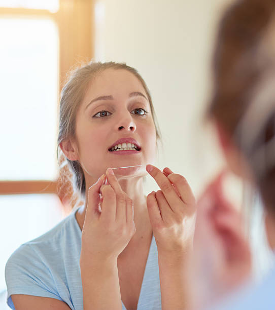 istock Flossing is part of her daily routine 613682786