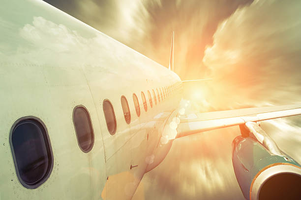 istock Airplane at fly on the sky with clouds 613683714