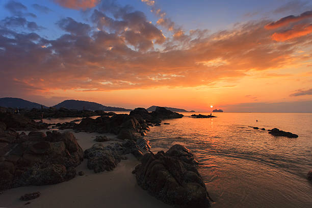 istock Rocks sea sunset 613684302