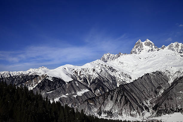 istock Snow mountains in winter at sunny day 613684596
