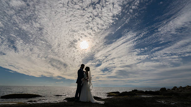 istock young bride couple on the beach sunset.. 613685476
