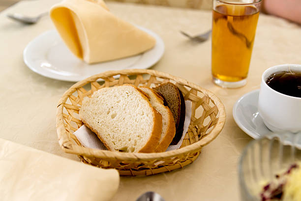 istock sliced rye and wheat bread in wicker basket 613686332