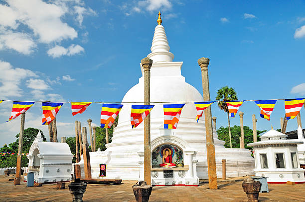 Thuparamaya Dagoba (Stupa) and Buddhist Flags, Anuradhapura, Sri Lanka Thuparamaya is a dagoba in Anuradhapura, Sri Lanka. It is a Buddhist sacred place of veneration. anuradhapura stock pictures, royalty-free photos & images