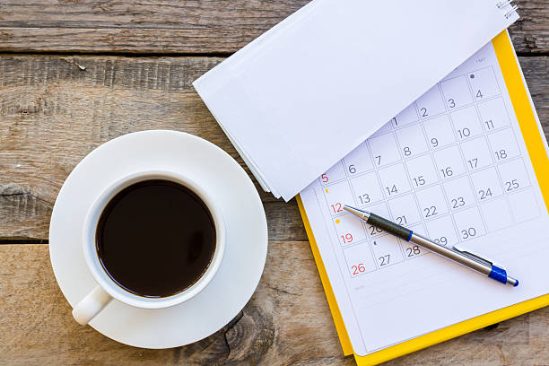 istock cup of coffee  with paper note on wood table background 613691068