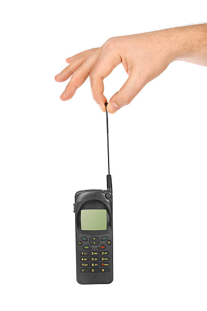 istock Hand with retro mobile phone 613691442