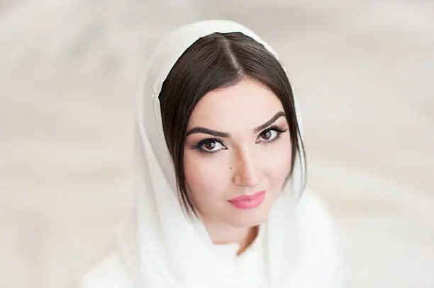 portrait of beautiful girl in white headscarf