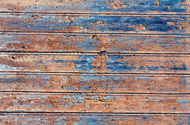 istock Orange weathered wood house wall 613691670