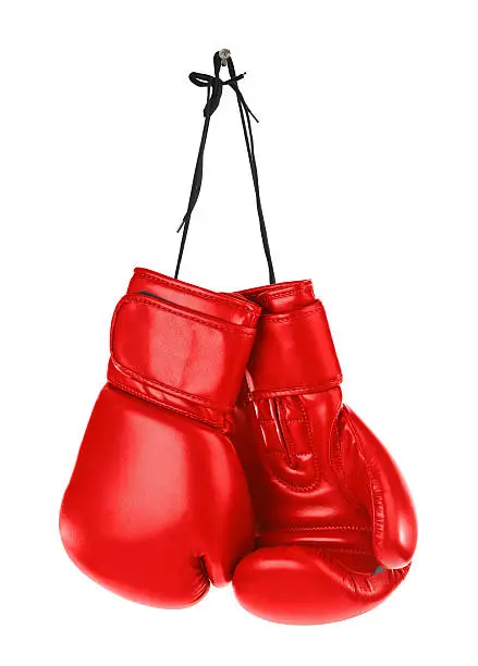 Hanging boxing gloves isolated on white background