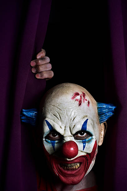 istock scary evil clown at the stage 613692910