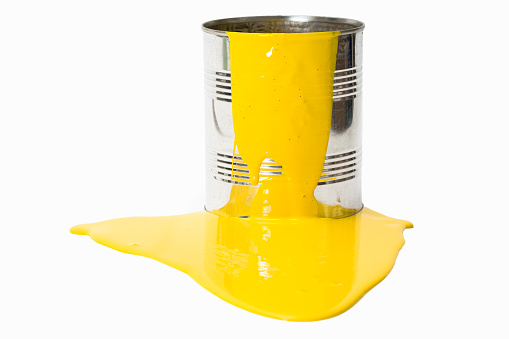 Bucket with spilled yellow paint