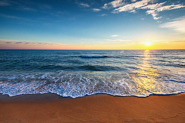 istock Beautiful sunrise over the sea 613695220