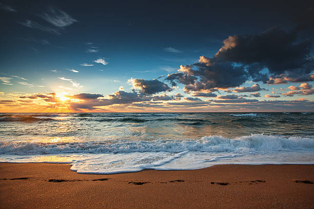 istock Beautiful sunrise over the sea 613695326
