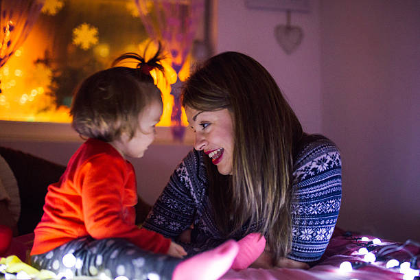 istock Mother and baby celebrating Christmas 613697294