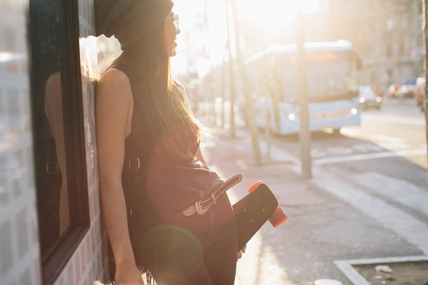 istock Young woman with smart phone in Barcelona, technology. 613748196