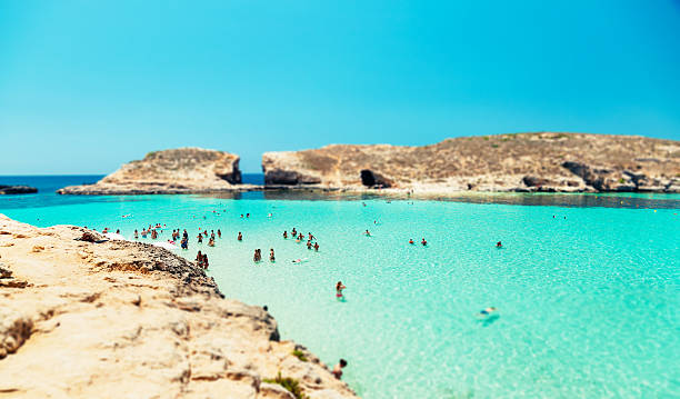 istock Blue lagoon, Comino - Malta. People relaxing in the water 613749522