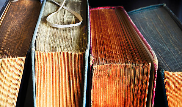 istock old books, close up 613750440