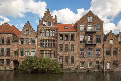 Historical old buildings by leie river at ghent belgium