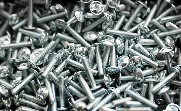 Photo of Heap of short metal bolts