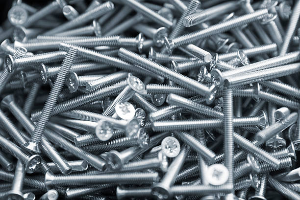 istock Heap of long metal countersunk bolts 613751478