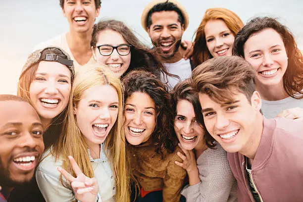 Large group of friends portrait at the beach