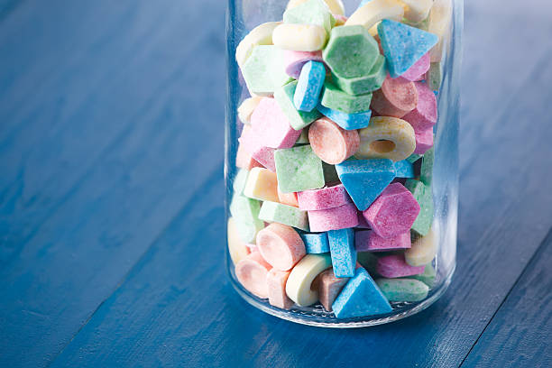 istock Colorful sweet candy in a wine carafe. 613753392