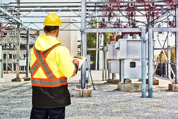 istock Rear view of worker working in power station 613753958