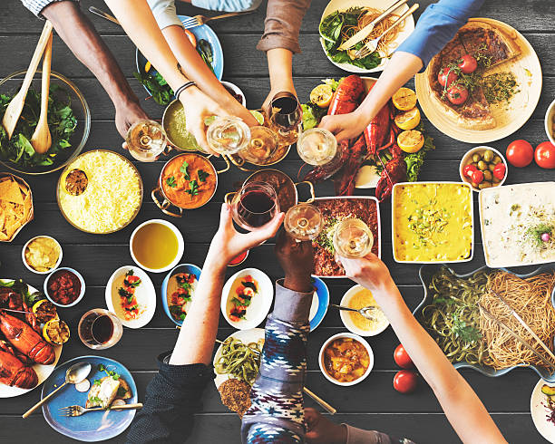 istock Friends Happiness Enjoying Dinning Eating Concept 613755242