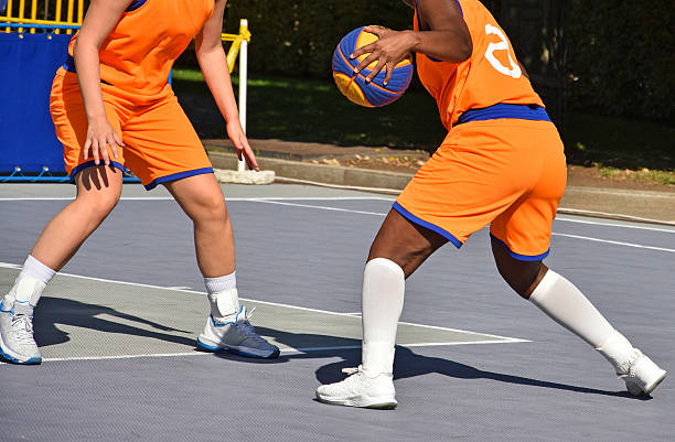 playing basketball outdoors - basketball basketball player shoe sports clothing imagens e fotografias de stock