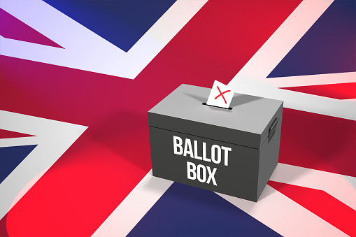 Casting a vote in a black ballot box for an election in the UK