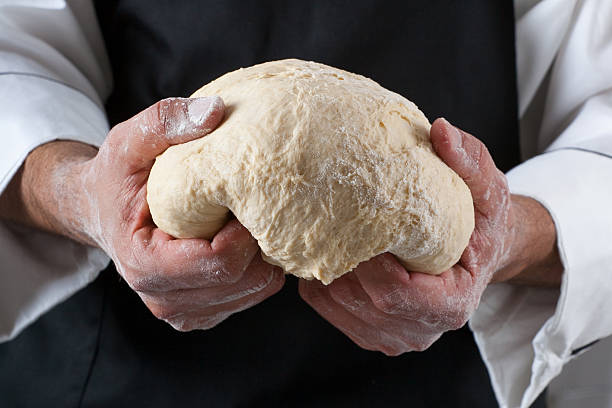 Chef kneading dough