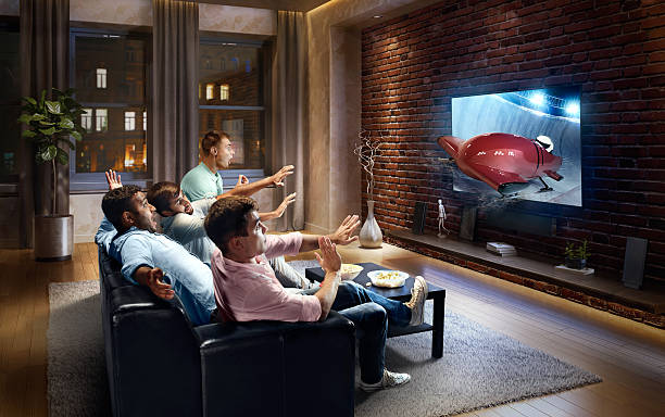istock Students watching very realistic Bobsleigh competition on TV 613759194