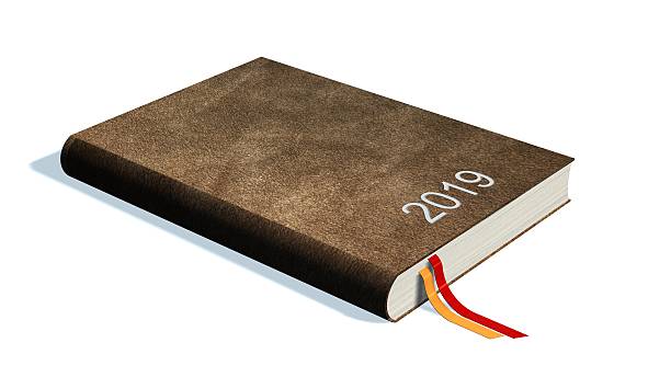 istock Brown calendar books notebooks year 2019 isolated on white 613759272