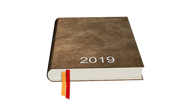 istock Brown calendar books notebooks year 2019 isolated on white 613759372