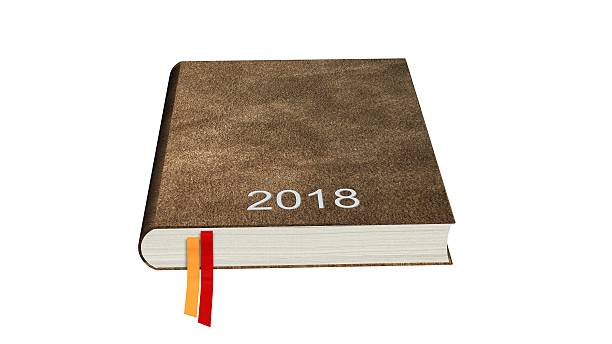 istock Brown calendar books notebooks year 2018 isolated on white 613760092