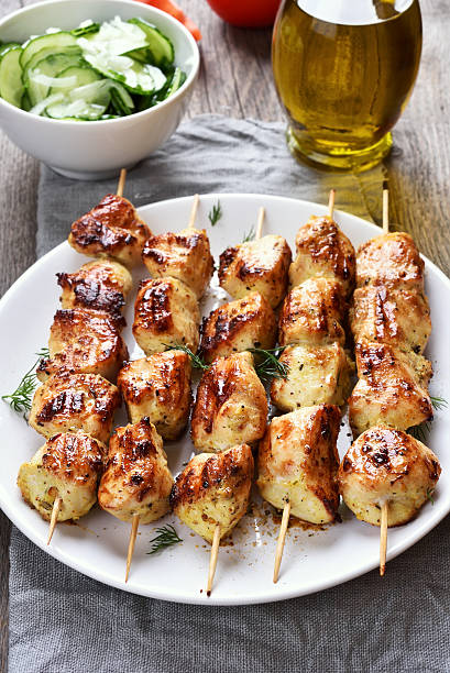 istock Grilled chicken meat on skewers 613761858